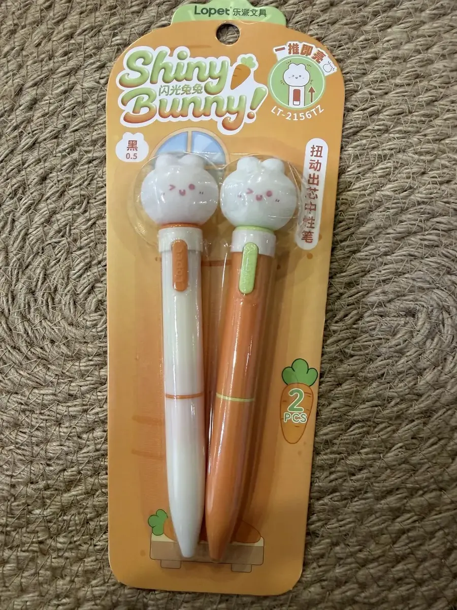 Two Shiny Bunny pens on a card.